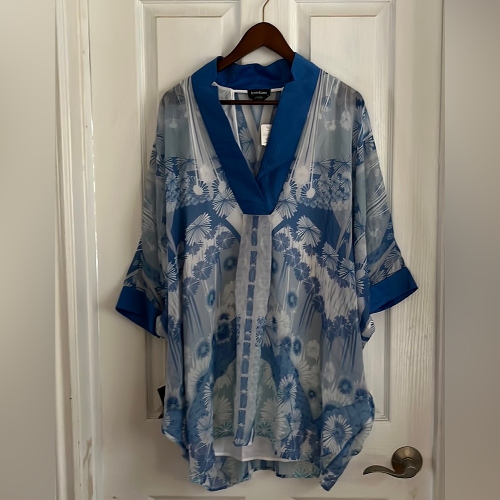 BeBe light blue, lining is white . Size small